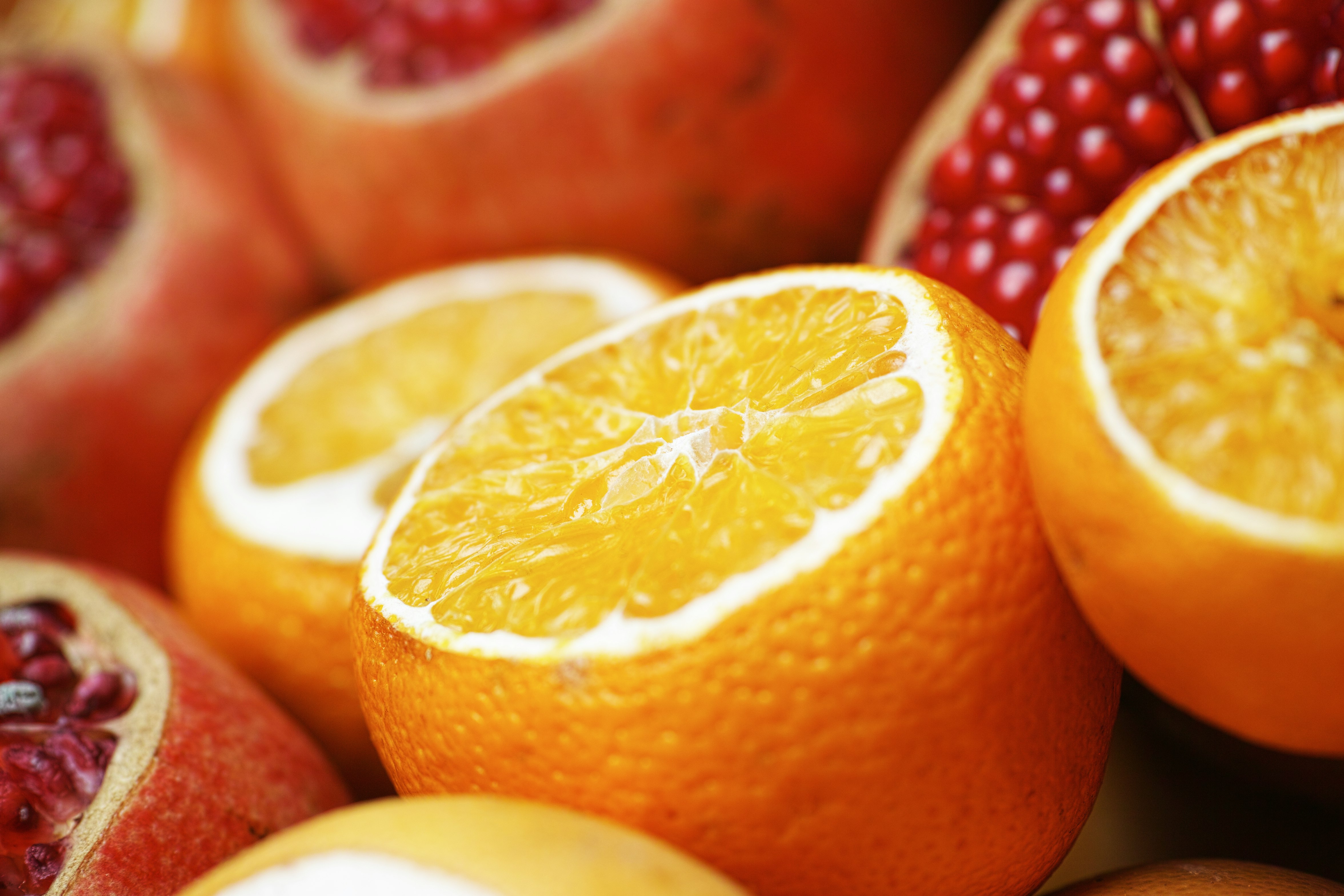 sliced orange fruit on white surface